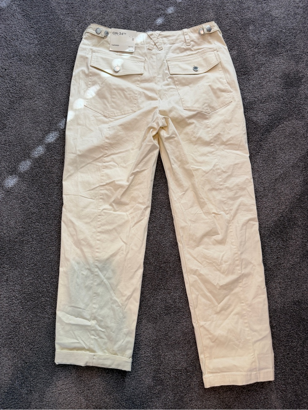 NWT cream tapered leg khakis